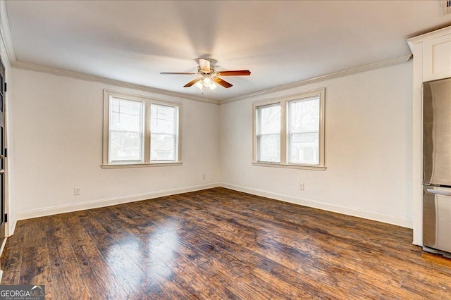 unfurnished room with plenty of natural light and crown molding