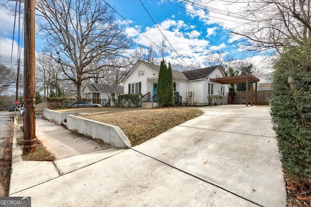 view of side of home with a carport