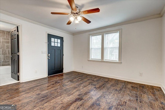 foyer with ceiling fan, ornamental molding, and dark wood-type flooring