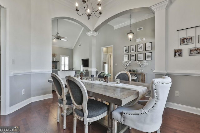 dining space featuring crown molding, high vaulted ceiling, dark hardwood / wood-style floors, and ceiling fan with notable chandelier