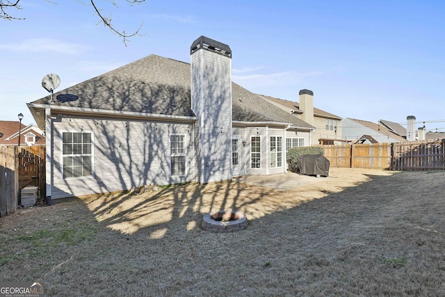 back of property with a patio