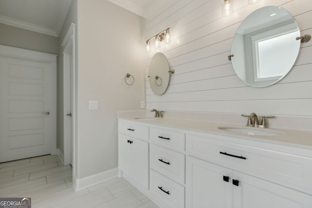 bathroom with ornamental molding and vanity