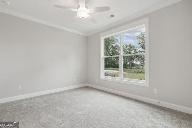 carpeted empty room featuring ornamental molding and ceiling fan