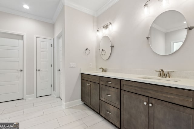 full bath featuring double vanity, ornamental molding, and a sink