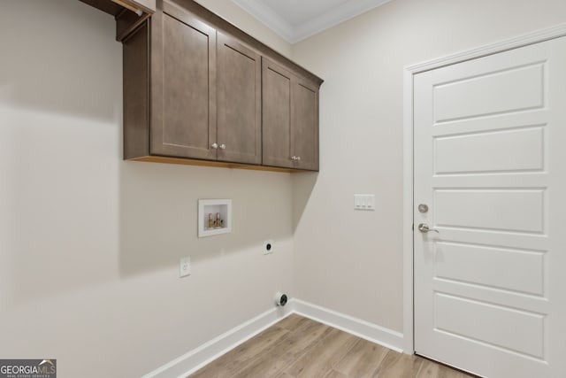 laundry area featuring electric dryer hookup, washer hookup, ornamental molding, cabinet space, and baseboards