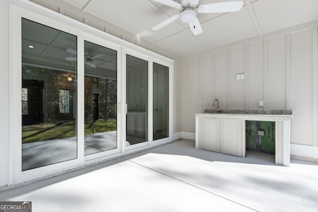 view of patio featuring a ceiling fan