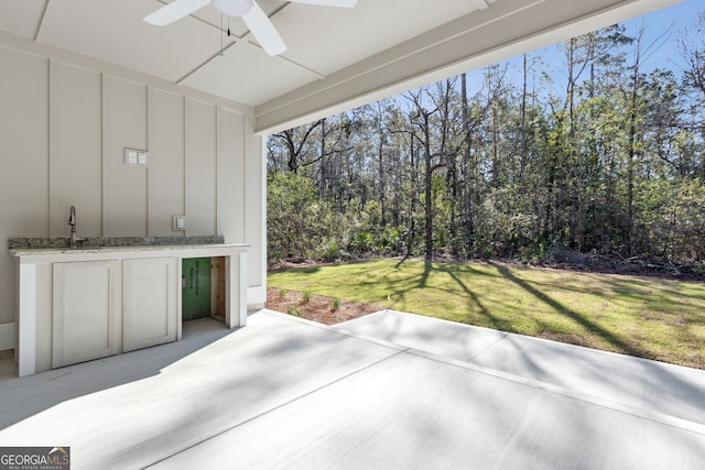 view of patio / terrace with a sink and a ceiling fan