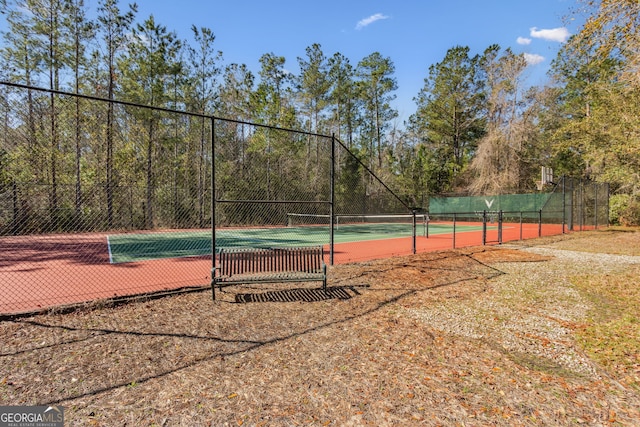 view of sport court with fence