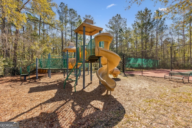 communal playground featuring fence