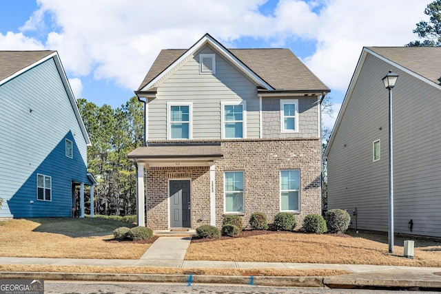 view of front facade featuring a front yard