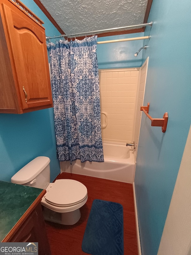 full bathroom featuring a textured ceiling, toilet, vanity, shower / tub combo, and hardwood / wood-style flooring