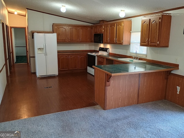 kitchen featuring kitchen peninsula, white appliances, lofted ceiling, and sink