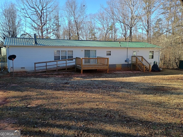 back of property with a deck