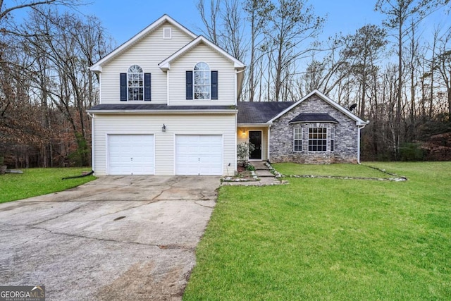 view of front property with a front lawn and a garage