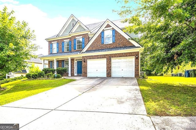 view of front of home with a front lawn and a garage