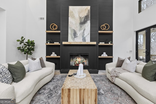 living room with a large fireplace