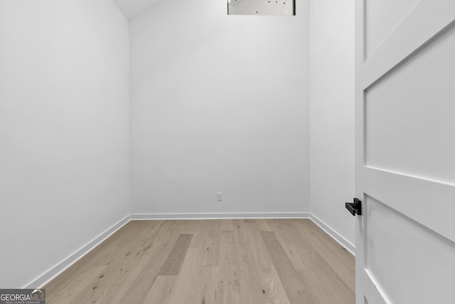 spare room featuring light hardwood / wood-style floors