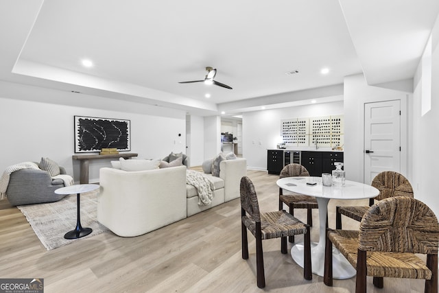 dining room featuring ceiling fan and light hardwood / wood-style flooring