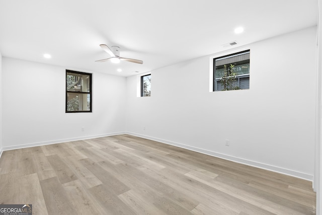 empty room featuring ceiling fan and light wood-type flooring