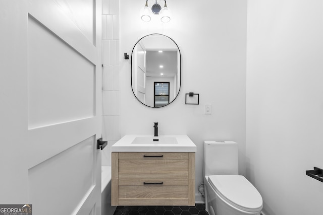 bathroom featuring vanity and toilet