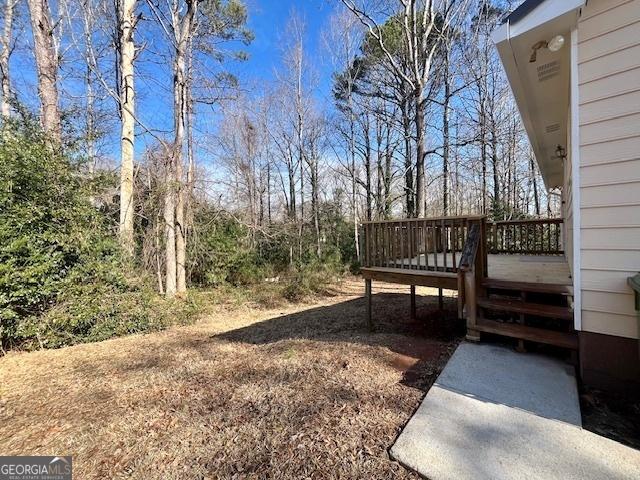 view of yard featuring a deck