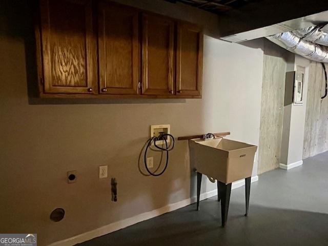 washroom with cabinets and hookup for a washing machine