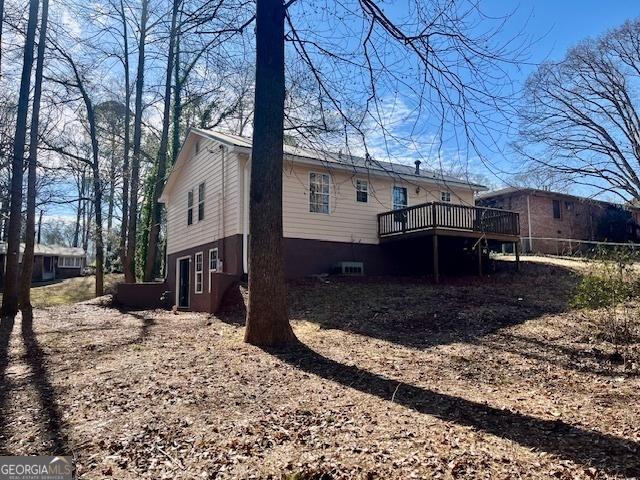 rear view of property with a deck