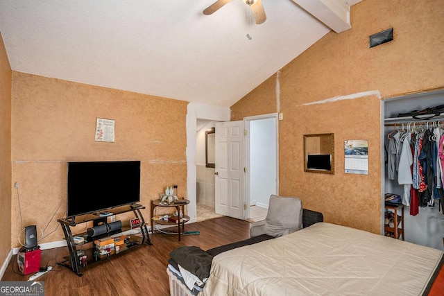 bedroom with hardwood / wood-style flooring, ceiling fan, beam ceiling, high vaulted ceiling, and a closet