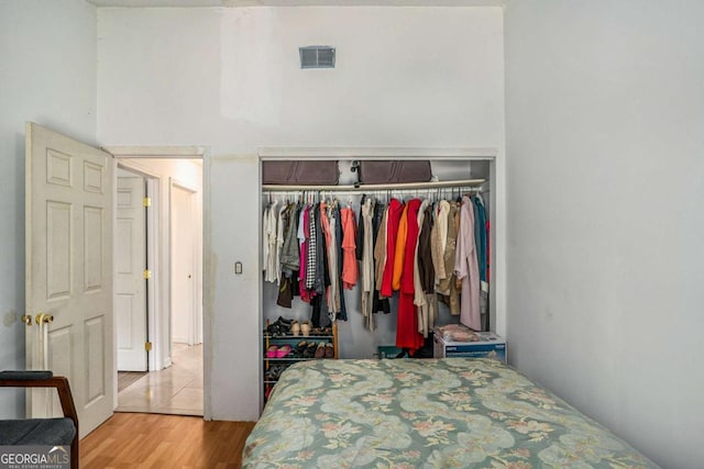 bedroom featuring a closet and light hardwood / wood-style flooring