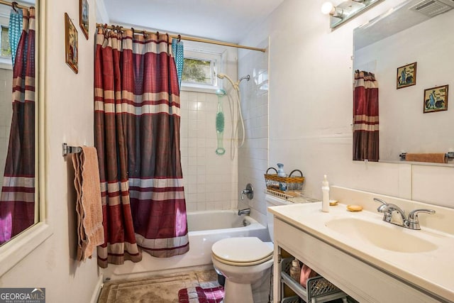 full bathroom featuring vanity, toilet, and shower / bath combo