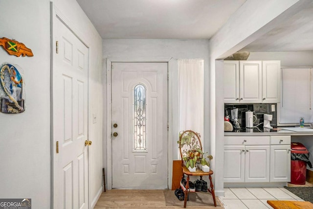 foyer entrance with light wood-type flooring