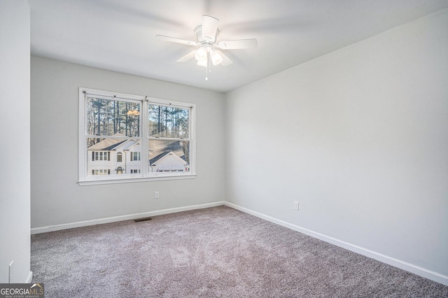 unfurnished room with carpet floors and ceiling fan