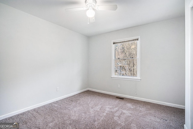 carpeted empty room with ceiling fan