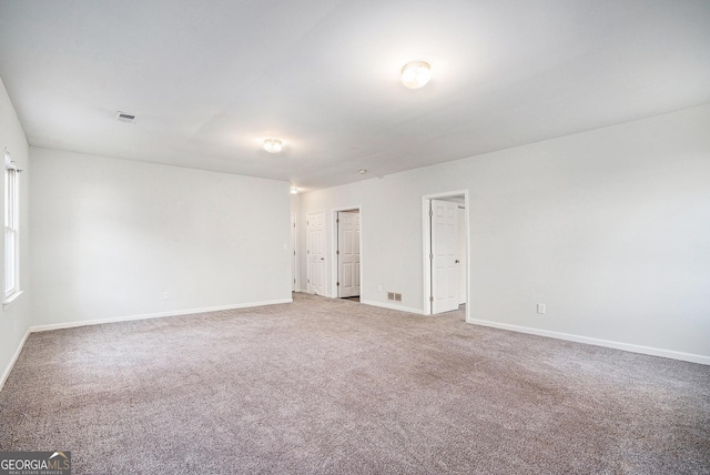 empty room with carpet flooring