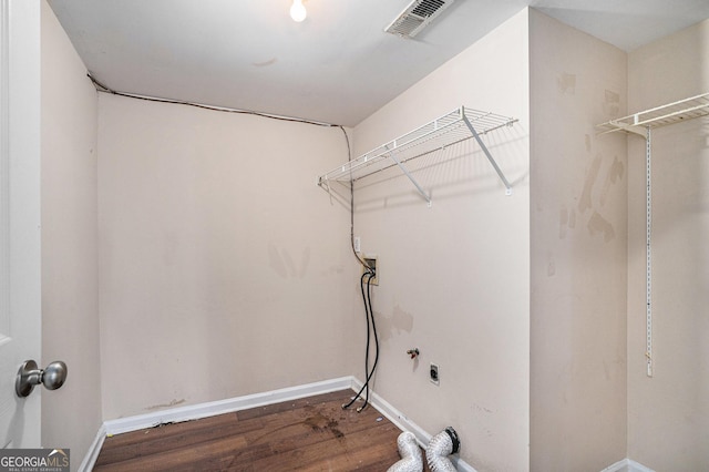 washroom featuring wood-type flooring, washer hookup, and hookup for an electric dryer