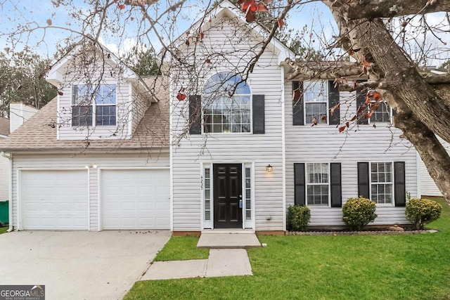 view of front of home with a garage and a front yard