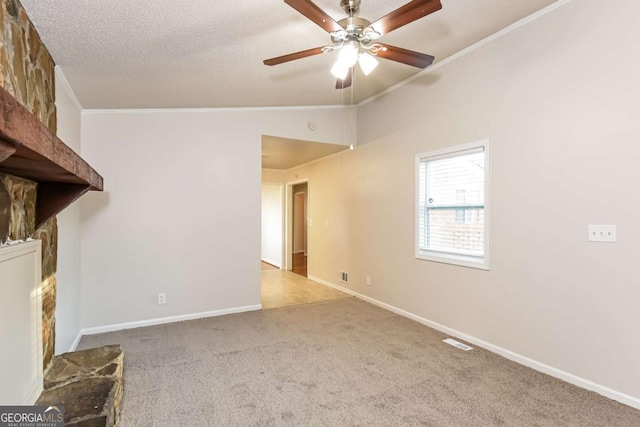 unfurnished living room featuring lofted ceiling, light colored carpet, ceiling fan, and ornamental molding