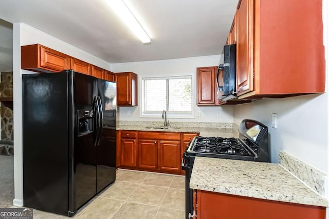 kitchen featuring black appliances, sink, light stone countertops, light tile patterned floors, and ornamental molding