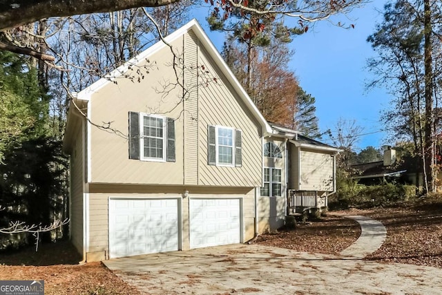 back of house featuring a garage