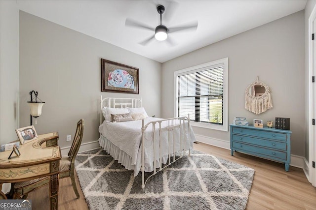 bedroom featuring light hardwood / wood-style floors and ceiling fan