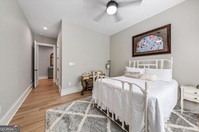 bedroom featuring hardwood / wood-style flooring and ceiling fan