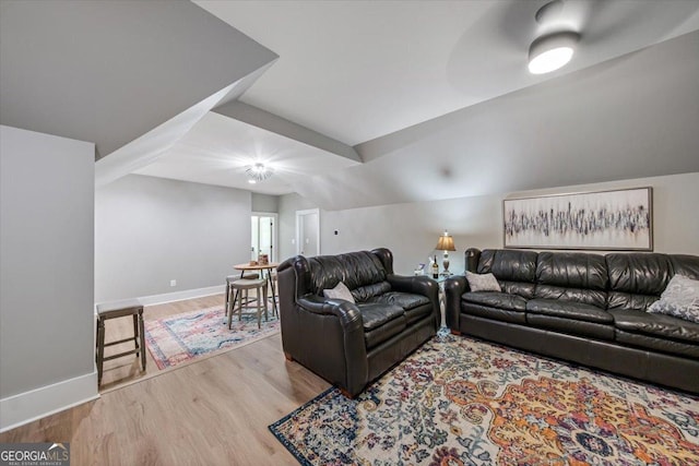 living room with hardwood / wood-style flooring and lofted ceiling