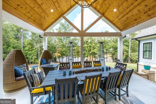 exterior space featuring wood ceiling, a wealth of natural light, and vaulted ceiling