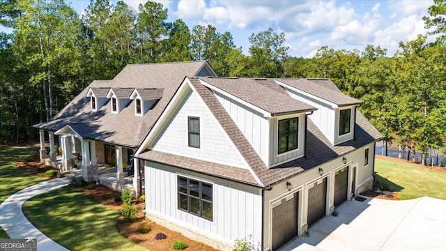 view of property exterior with a yard and a garage