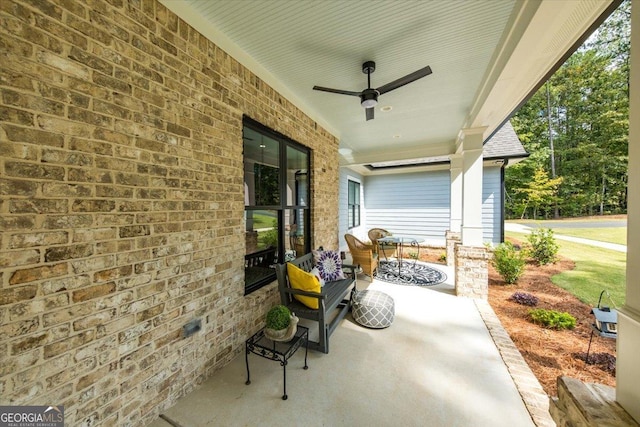 view of patio / terrace with ceiling fan and a porch