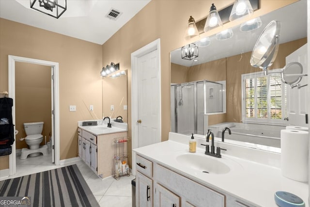 bathroom featuring vanity, tile patterned flooring, toilet, a notable chandelier, and an enclosed shower