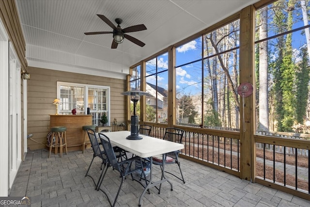 sunroom / solarium with ceiling fan