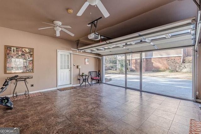 garage with a ceiling fan, baseboards, and a garage door opener