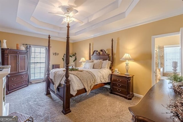 bedroom featuring a tray ceiling, light colored carpet, and crown molding