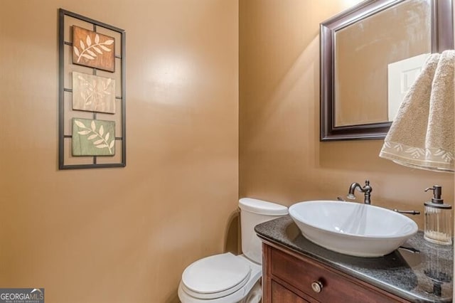 half bath with toilet and vanity